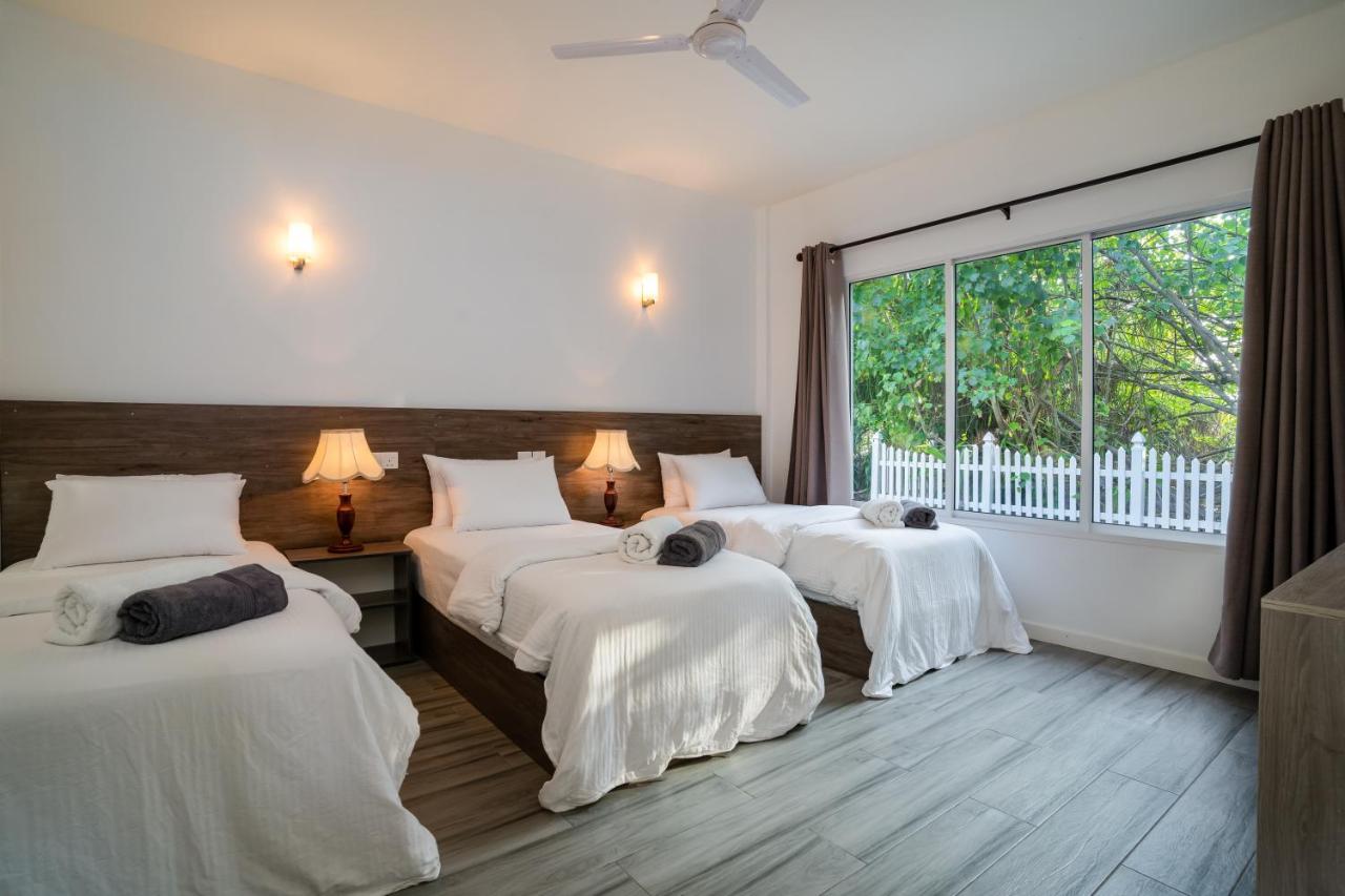 Seaview room interior with multiple beds